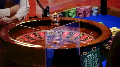 Close-Up of a Roulette Wheel in Motion at a Casino Video stock 308848450