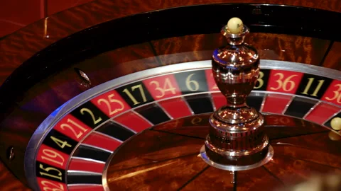 Close-Up of a Roulette Wheel in Motion at a Casino Stock-Footage 308849281