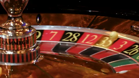 Close-Up of a Roulette Wheel in Motion at a Casino Stock-Footage 308849386