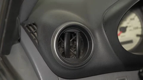 A close up of a round car dashboard air vent. Stock Footage 342730155