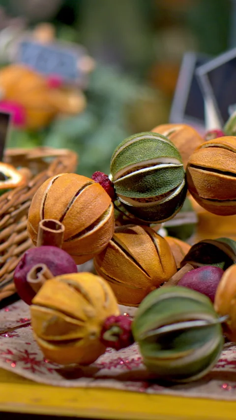 Close up of round Christmas decorations made out of cinnamon and oranges on Stock Footage 297227318