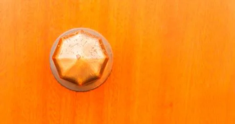 Close up on a round door handle with decorative elements, door decoration Stock Photos
