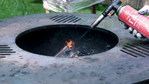 A close-up of the round frying surface with burning wood inside. Stock Footage 222815574