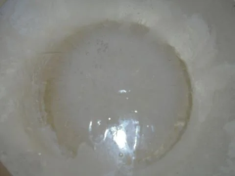 Close up of round ice disk from a bucket with radial crystal patterns Stock Photos