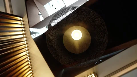 Close-up of a round lamp hanging above the table Stock Footage 136560705