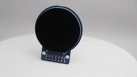 Close up of round lcd screen rotating on white background Stock Footage 345885493