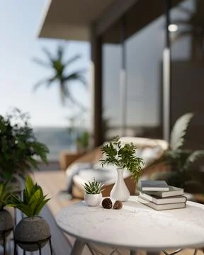A close-up of a round table with decorative objects on a balcony with a stu.. Stock Photos