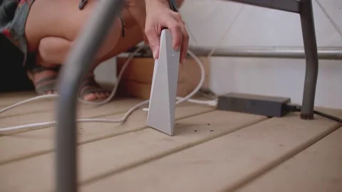 Close up of router being placed on the ground, starlink 库存影片 213489483