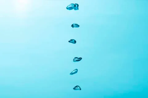 Close up to row of  air bubble , isolated on blue background. Stock Photos