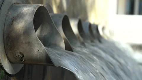 Close Up of Row of Drainage Pipes Pumping Out Clear Clean Water Stock Footage 149021503