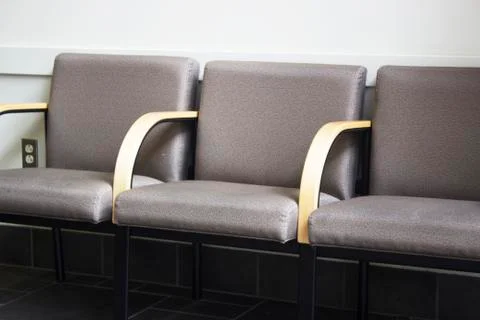 Close up of row of empty chairs in office waiting room Stock Photos