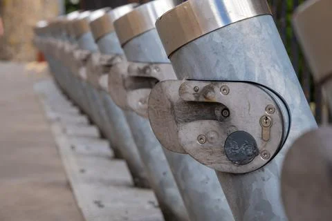 Close up of a row of numerous empty bike share stations Stock Photos