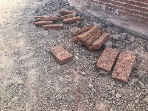 Close up row of old red brick at construction site Stock Photos