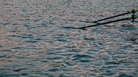 Close-Up of Rowing Oars on Lake Water Stock Footage 335389364