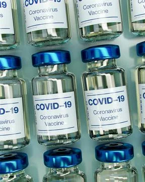 Close up of rows of blue coronavirus vials Stock Photos