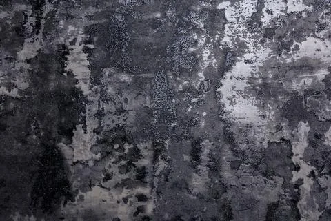 Close-up of a rugged concrete texture wall in grayscale with natural wear, water Stock Photos
