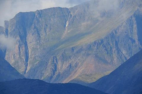 Close-up of rugged mountain cliffs with mist Stock Photos