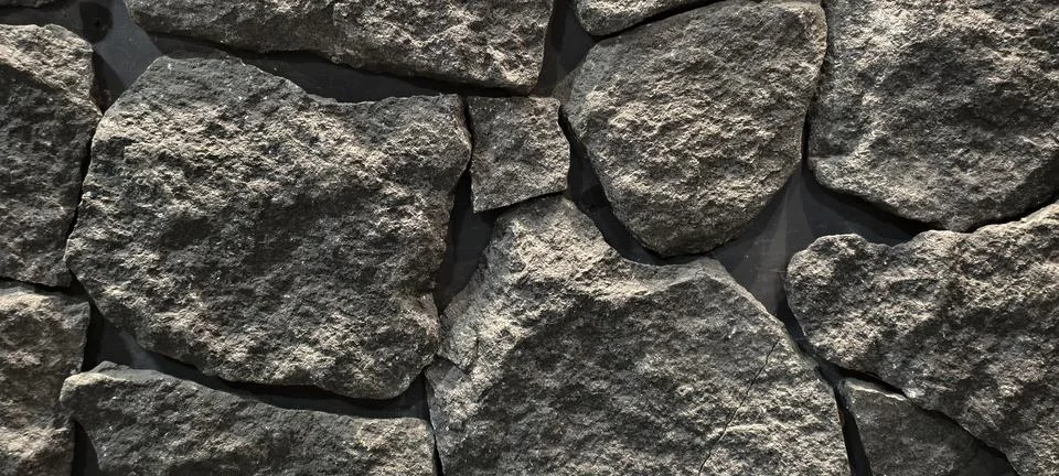 Close‑up of a rugged stone wall Foto stock