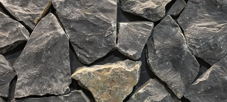 Close‑up of a rugged stone wall Fotos Stock