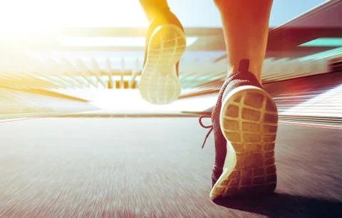 Close up of runner legs run on the stadium . Stock Photos
