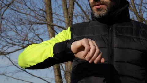 Close-up on runner looking at smartwatch Stock Footage 123284995