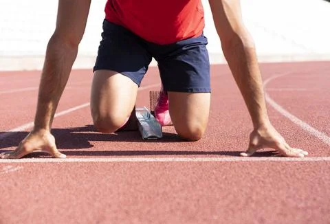 Close-up of runner ready to run on starting line Stock-Fotos