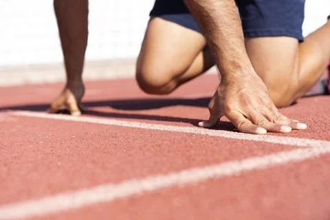 Close-up of runner ready to run on starting line Stock Photos