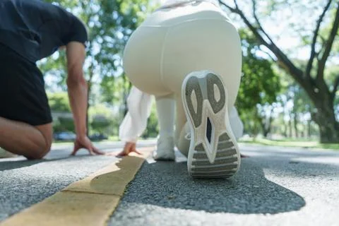 Close up of runner shoe at starting line for outdoor race start Stock Photos