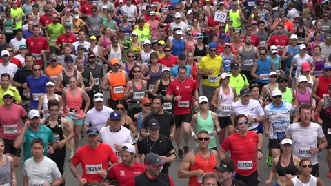 Close up of runners in a marathon Stock Footage 139976972