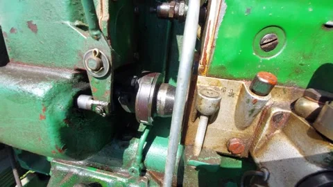 Close up of a running green diesel engine with moving mechanical parts Vídeos de archivo 336391375