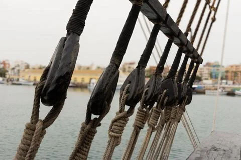 Close-up of the running rigging system on an old caravel ship. Stock Photos