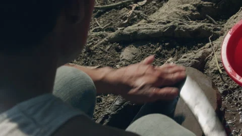 Close up of rural man sharpening knife with stone, Laos Stock Footage 134293195