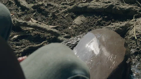 Close up of rural man sharpening knife with stone, Laos Stock Footage 134295829