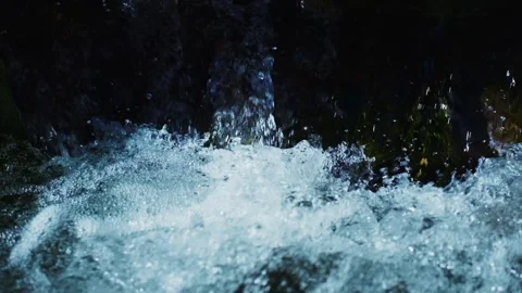 Close-up of rushing water hitting rocks Stock Footage 342735917