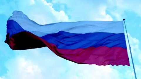 Close up russian flag waving on the breeze on blue sky Stock Footage 84522592
