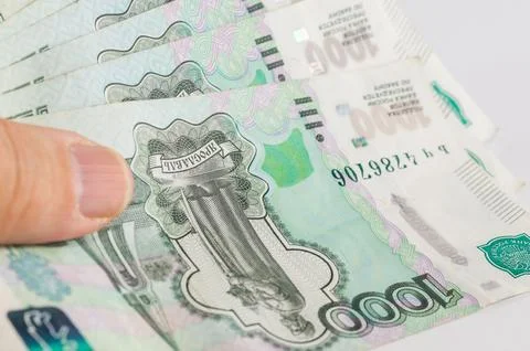 A close-up of a Russian thousand-ruble banknote in a hand Stock Photos