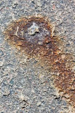 Close-up of rust on rough, gray stone surface Stock Photos