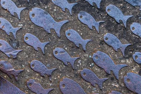 Close Up of Rusted Bird Pattern Metal Ground Stock Photos