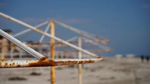 Close-up of rusted racks from umbrellas at the seaside in the spring Stock Footage 106263479