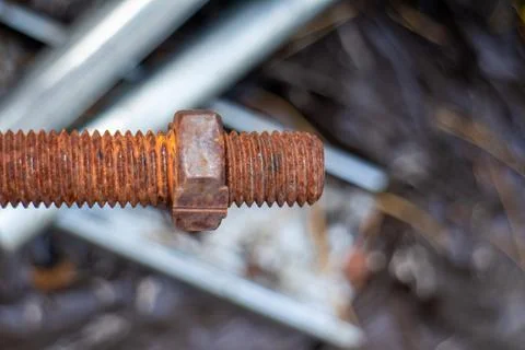 Close-up of a rusted threaded bolt and nut outdoors Photos