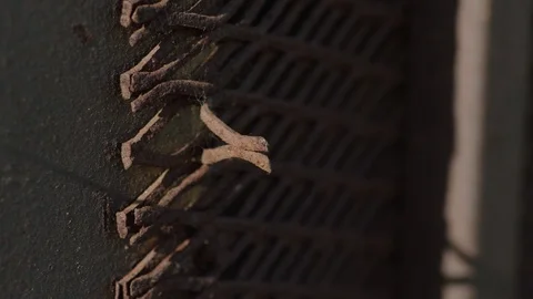 Up close of rusted window cover Stock Footage 106587353