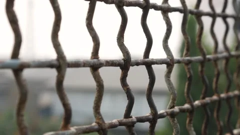 Close Up of Rusted Wire Fence With Blurred Natural Background Stock Footage 337638465