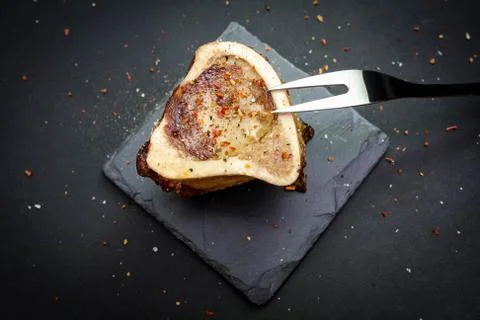 Close-up of rustic English bone marrow with pickled onions, radishes and cape Stock Photos