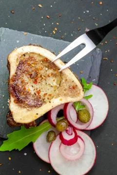 Close-up of rustic English bone marrow with pickled onions, radishes and cape Stock Photos