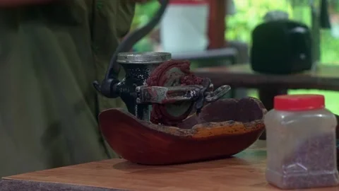 Close-up of a rustic mechanical cocoa bean grinder used to create chocolate Stock Footage 304111452