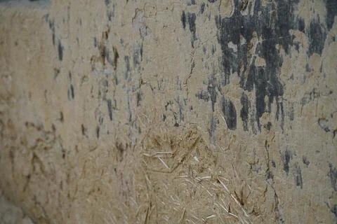 Close up of rustic mud and straw wall texture in a rural agricultural setting Stock Photos