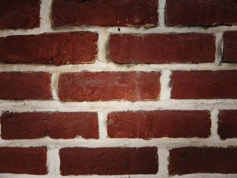 Close-up of rustic red brick wall with white mortar texture Stock Photos