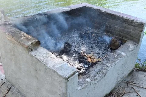 Close-up of rustic stone grill with smoke at La Tovara in San Blas Mexico Stock Photos
