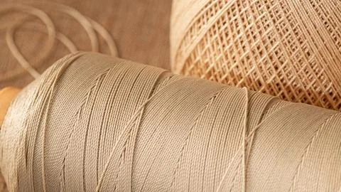 Close-up of rustic style textured thread spools in a craft store Stock Photos