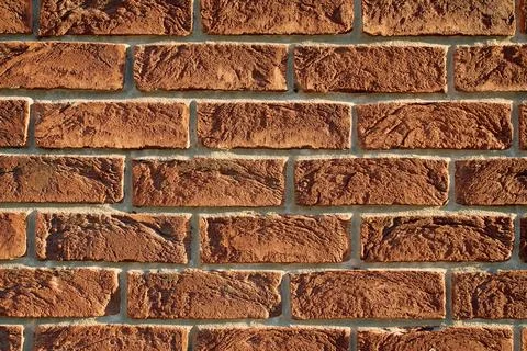 Close-up of rustic textured red brick wall with clean mortar Stock Photos